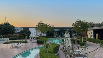 Outdoor pool, pool umbrellas, pool loungers