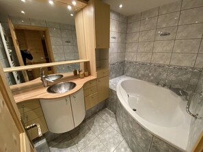 Shower, jetted tub, towels, soap