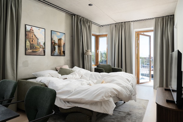 Apartment, 2 Bedrooms | Living area | 43-inch TV with digital channels