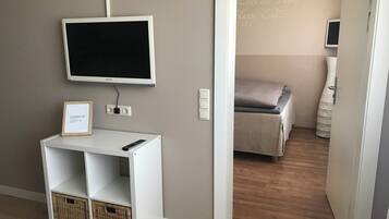 1 bedroom, desk, iron/ironing board, travel crib