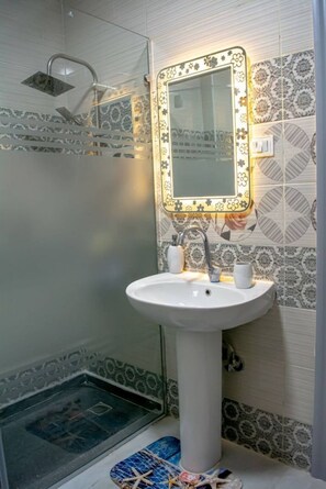 Bidet, towels, soap, toilet paper