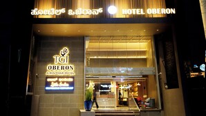 A modern hotel entrance with a prominent sign for "HOTEL OBERON" and "TGI OBERON A BOUTIQUE HOTEL." - TGI Oberon  (Bengaluru)