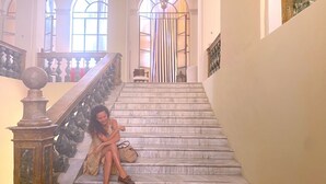 A grand staircase with marble steps and a balustrade, leading to a gated entrance. - Live in PALAZZO, historic center, 7 km from the sea (Fermo)