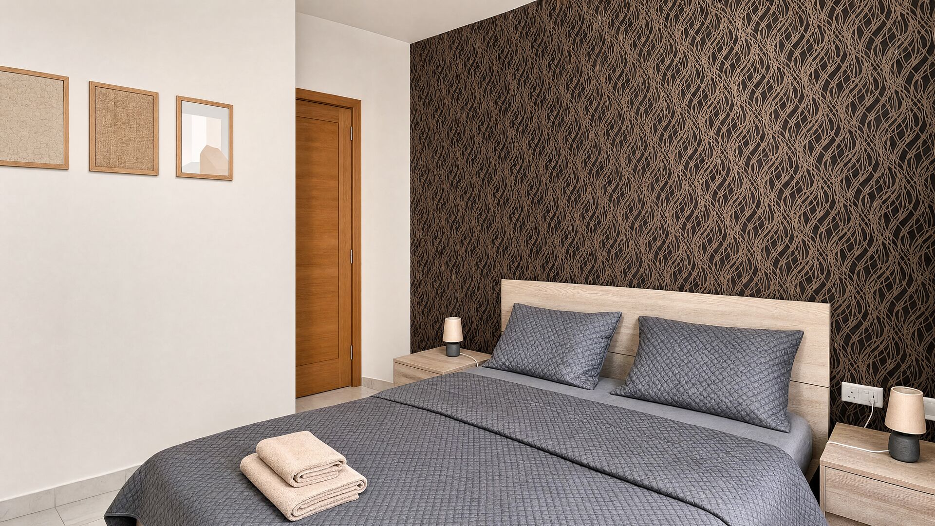 A modern bedroom with a large bed, two bedside tables, a wooden door, and a textured wall.