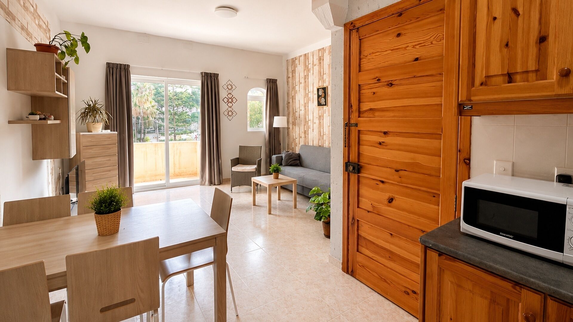 A modern kitchen with wooden cabinets and a microwave.