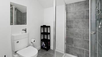 Shower, hair dryer, towels, toilet paper