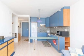 Fridge, microwave, coffee/tea maker, cookware/dishes/utensils