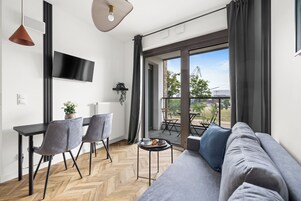 Apartamento conforto | Área de estar | TV de tela plana