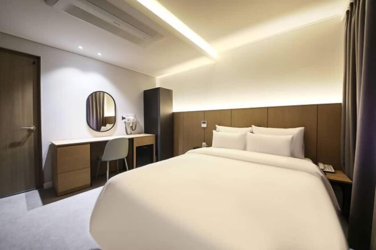 Premium bedding, memory-foam beds, desk, laptop workspace