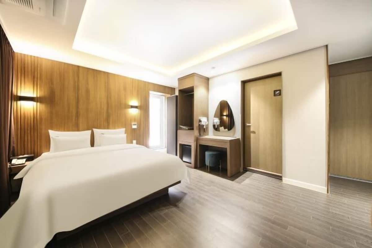 Premium bedding, memory-foam beds, desk, laptop workspace