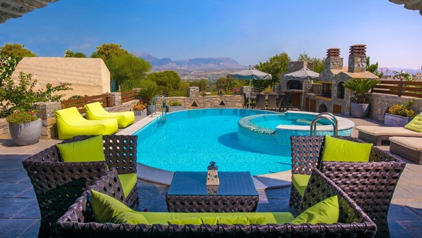 A pool area with wicker furniture and a view of mountains. - Villa Belladonna - Heraklion Private Pool Getaway (Faistos)