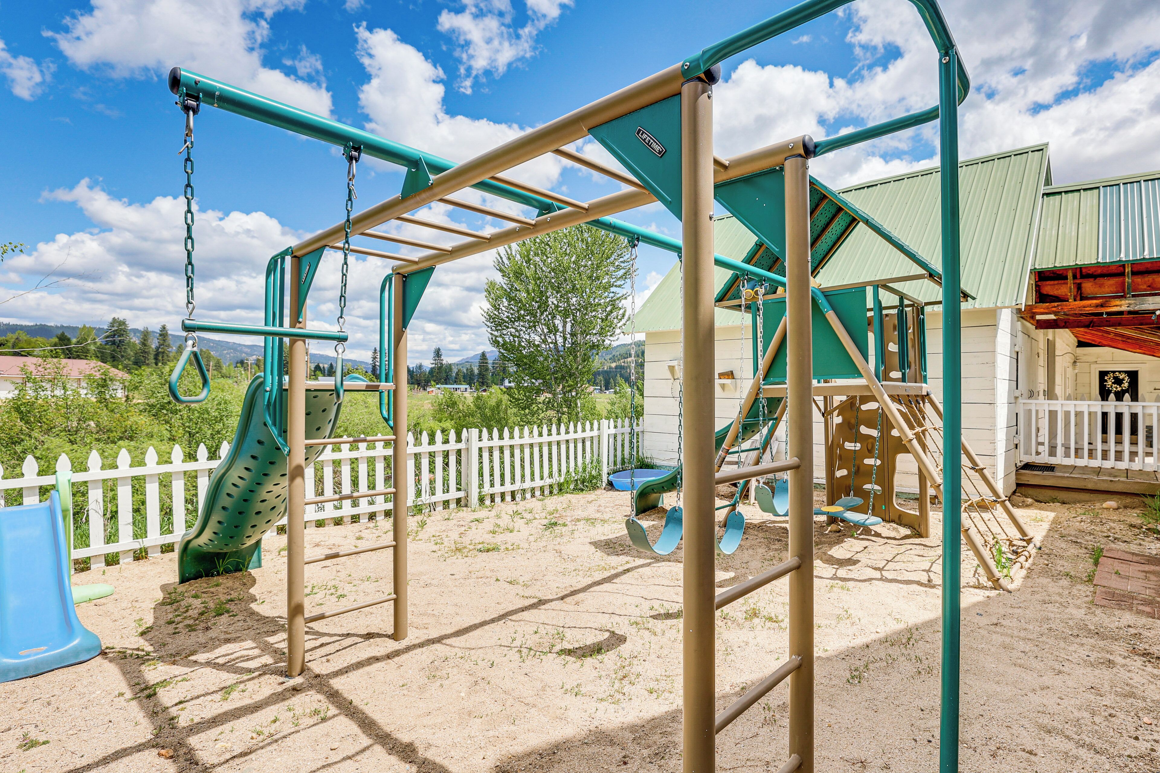 A playground with swings, slides, and climbing structures.