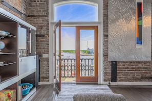 Enjoy a waterfront view from the large window and step out onto the balcony.