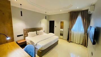 Luxury Apartment, 3 Bedrooms, Balcony, Garden View | 3 bedrooms, desk, laptop workspace, iron/ironing board