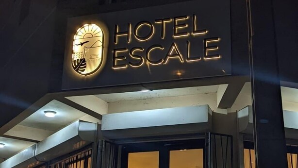 A hotel named "Hotel Escale" with a prominent illuminated sign. - Hôtel Escale (Antananarivo)