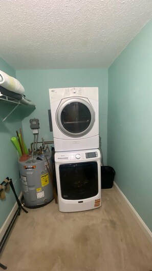 Convenient laundry facilities with a washer and dryer unit.