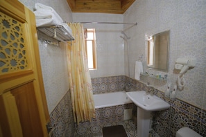 Hair dryer, slippers, towels, soap