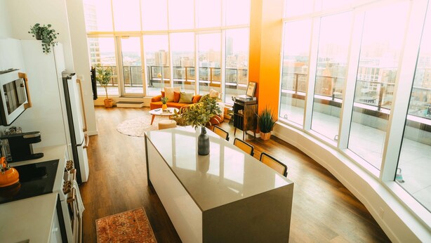 A modern kitchen with a central island, large windows, and a view of the city. - *Penthouse* - Luxe Stay with Views - Free Parking (Halifax)