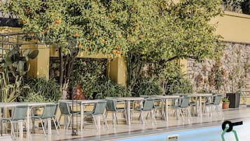 Seasonal outdoor pool, open 9:00 AM to 7:00 PM, pool umbrellas