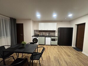 Room, 1 Bedroom, Smoking | Dining room - Room in Apartment - Guesthouse Imperia 9 Numeris (Siauliai)