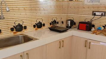 Fridge, coffee/tea maker, electric kettle, toaster