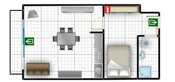A hotel room layout with a bed, a sofa, a desk, a chair, a bathroom with a toilet and sink, and a small balcony. - Studio in Middelkerke Near Sea Wall (Middelkerke)