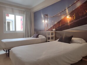 Down duvets, desk, laptop workspace, blackout curtains