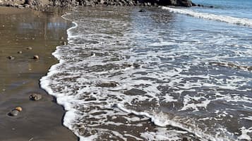 Beach nearby, black sand, 2 beach bars