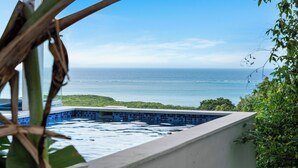 A swimming pool with a view of the ocean. - Endless Island Horizons @ Coral Views, French Harbor (French Harbor)