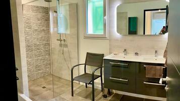 Shower, hair dryer, towels, toilet paper