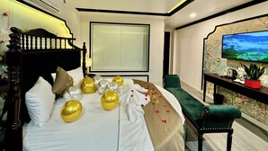 A hotel room with a bed, a TV, a desk, and a large window. - Bao Anh Hotel (Hanoi)