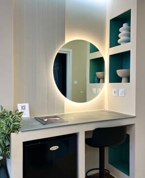 A modern bathroom with a round mirror, a sink, and a small cabinet. - Monastiraki 308 Superhost Hub (Athens)