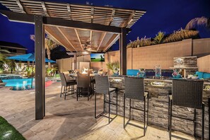 Outdoor dining - 8BR/5.5BA Luxury Retreat w/4 En-Suites, HEATED Pool, Hot Tub,Billiards & Arcades (Peoria)
