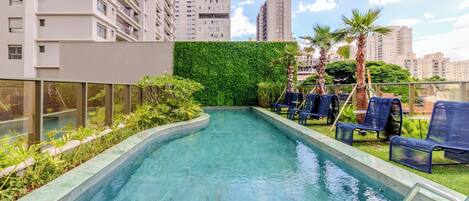 Outdoor pool, pool umbrellas, sun loungers