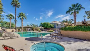 A pool area with multiple pools, lounge chairs, and palm trees. - 3BR/2 Bath w/Pool & Hot Tub- Scottsdale Entertainment District (Scottsdale)