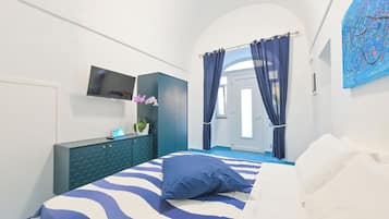 Deluxe Apartment, Partial Sea View | Free minibar, in-room safe, desk, blackout drapes