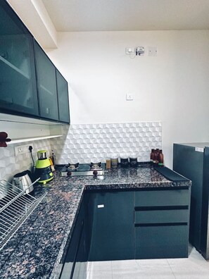 Fridge, microwave, stovetop, cookware/dishes/utensils - Pelican: 2BHK Modern AC Flat on Baner Road, Pune (Pune)