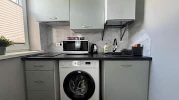 Fridge, microwave, stovetop, cookware/dishes/utensils