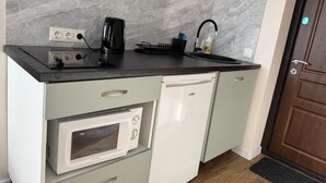 Fridge, microwave, cookware/dishes/utensils
