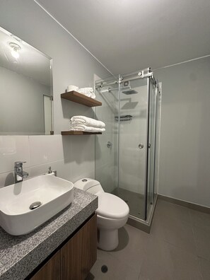 Hair dryer, towels, soap, toilet paper