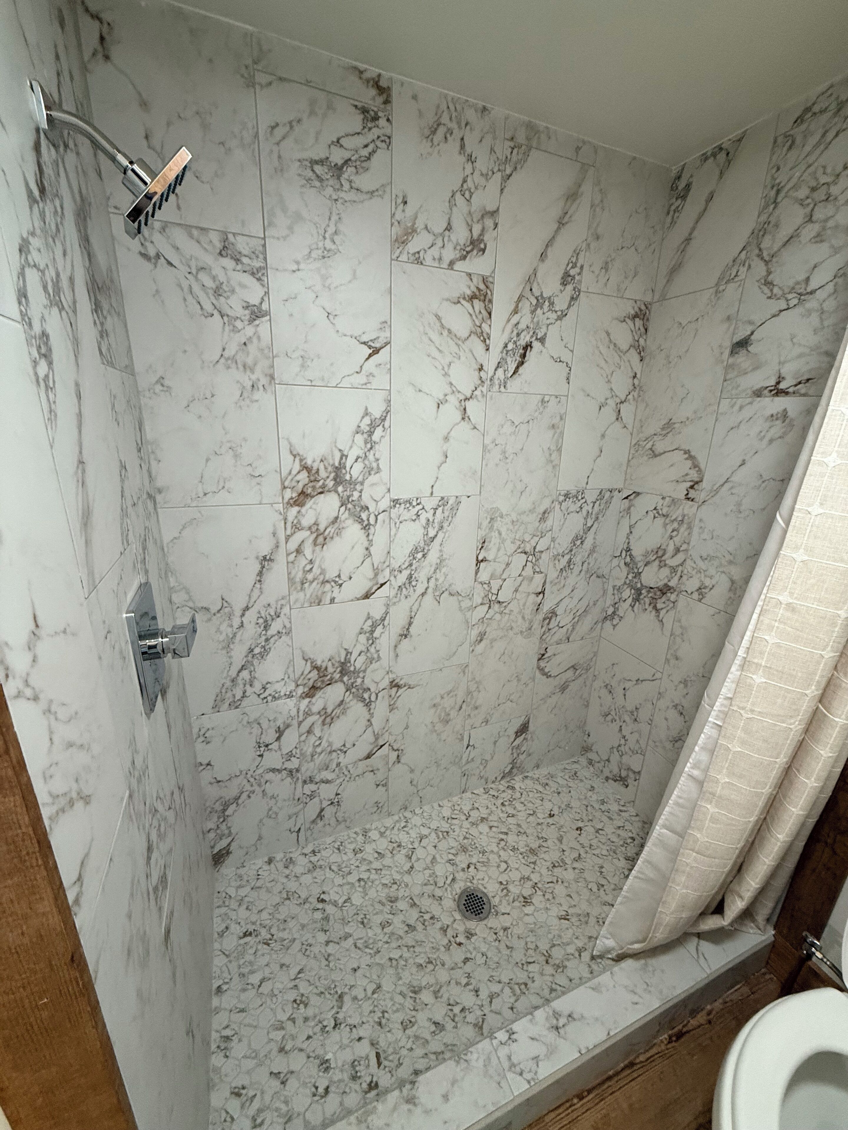 Shower, hair dryer, towels, toilet paper