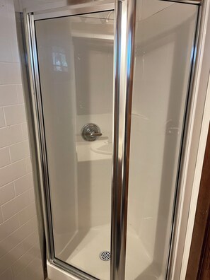 Shower, towels, soap, toilet paper