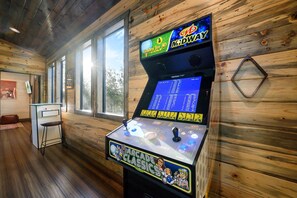 A wooden interior with a gaming machine featuring a golf theme.