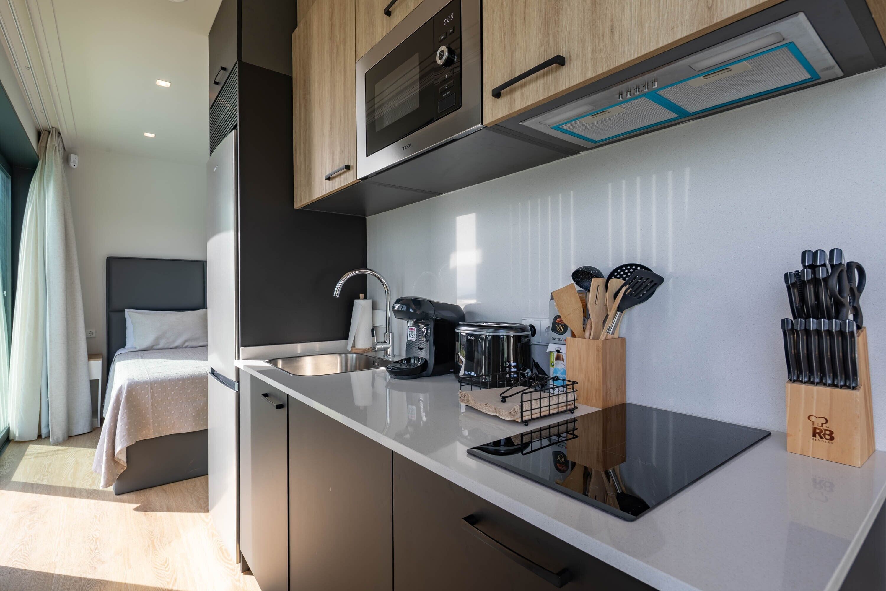 Fridge, microwave, stovetop, coffee/tea maker