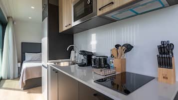 Fridge, microwave, stovetop, coffee/tea maker