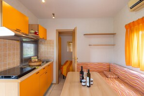 Fridge, stovetop, highchair, cookware/dishes/utensils