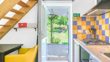 Fridge, stovetop, coffee/tea maker, cookware/dishes/utensils