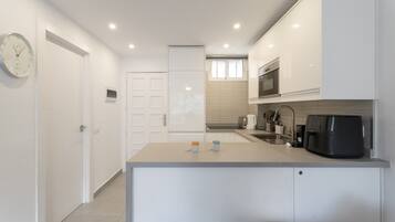 Fridge, microwave, coffee/tea maker, highchair