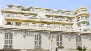 A multi-story building with balconies and decorative railings. - Le Mirazur by Interhome (Nice)