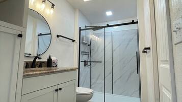 Shower, hair dryer, towels, soap